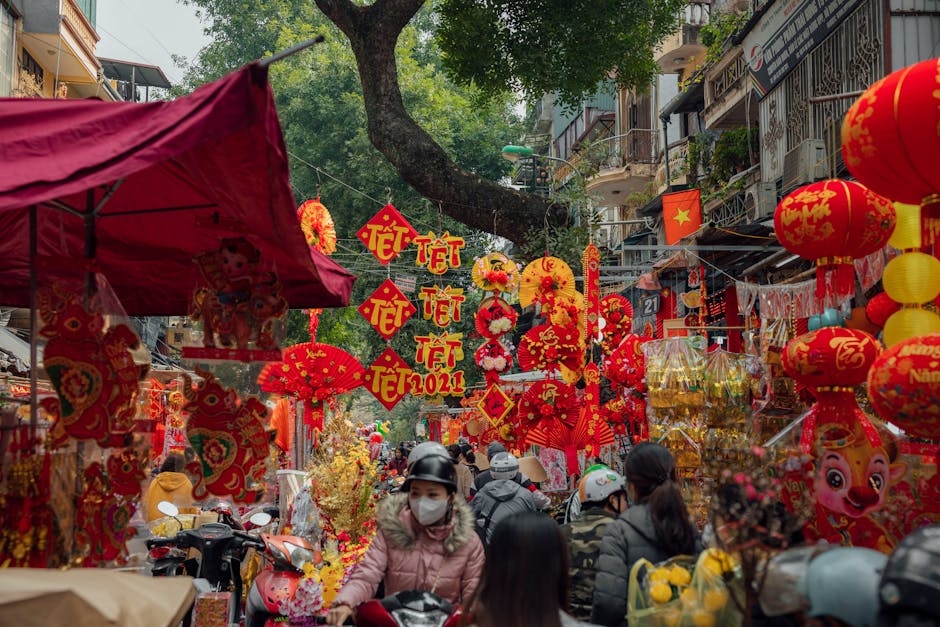 Bustling Tết festival market with lanterns and decorations in a vibrant Vietnamese street.