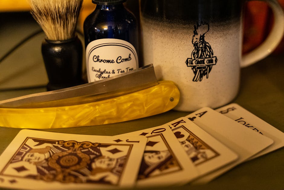 Close-up of a vintage shaving set with a mug and playing cards, embodying classic grooming style.