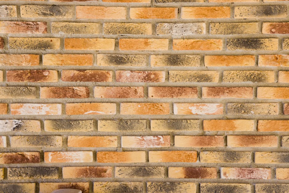 Close-up of a textured brick wall showcasing intricate patterns and warm colors.
