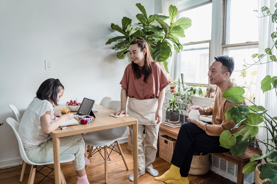 A family enjoying quality time together surrounded by lush indoor plants.
