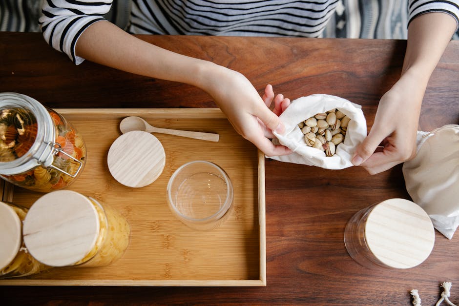 Eco-conscious kitchen scene showcasing pistachios in reuseable packaging and glass jars, emphasizing sustainability.