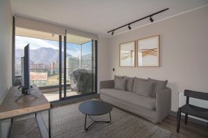 Contemporary living room featuring a cozy sofa, stylish decor, and stunning mountain view.